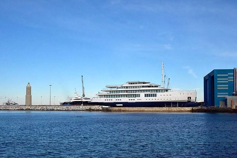 a cruise ship docked at a port aboard LUMINOSITY Yacht for Sale