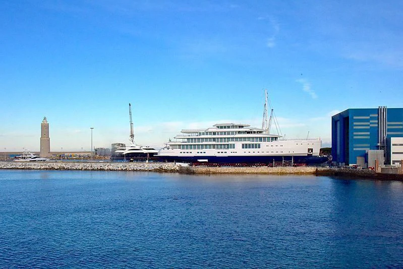 a large cruise ship docked aboard LUMINOSITY Yacht for Sale