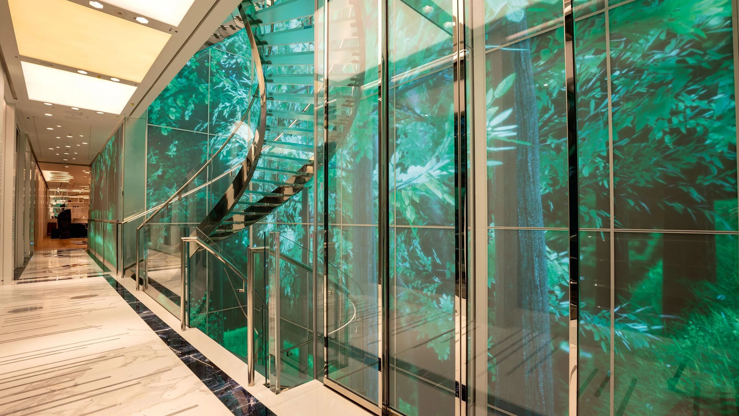 a large room with glass walls aboard LUMINOSITY Yacht for Sale