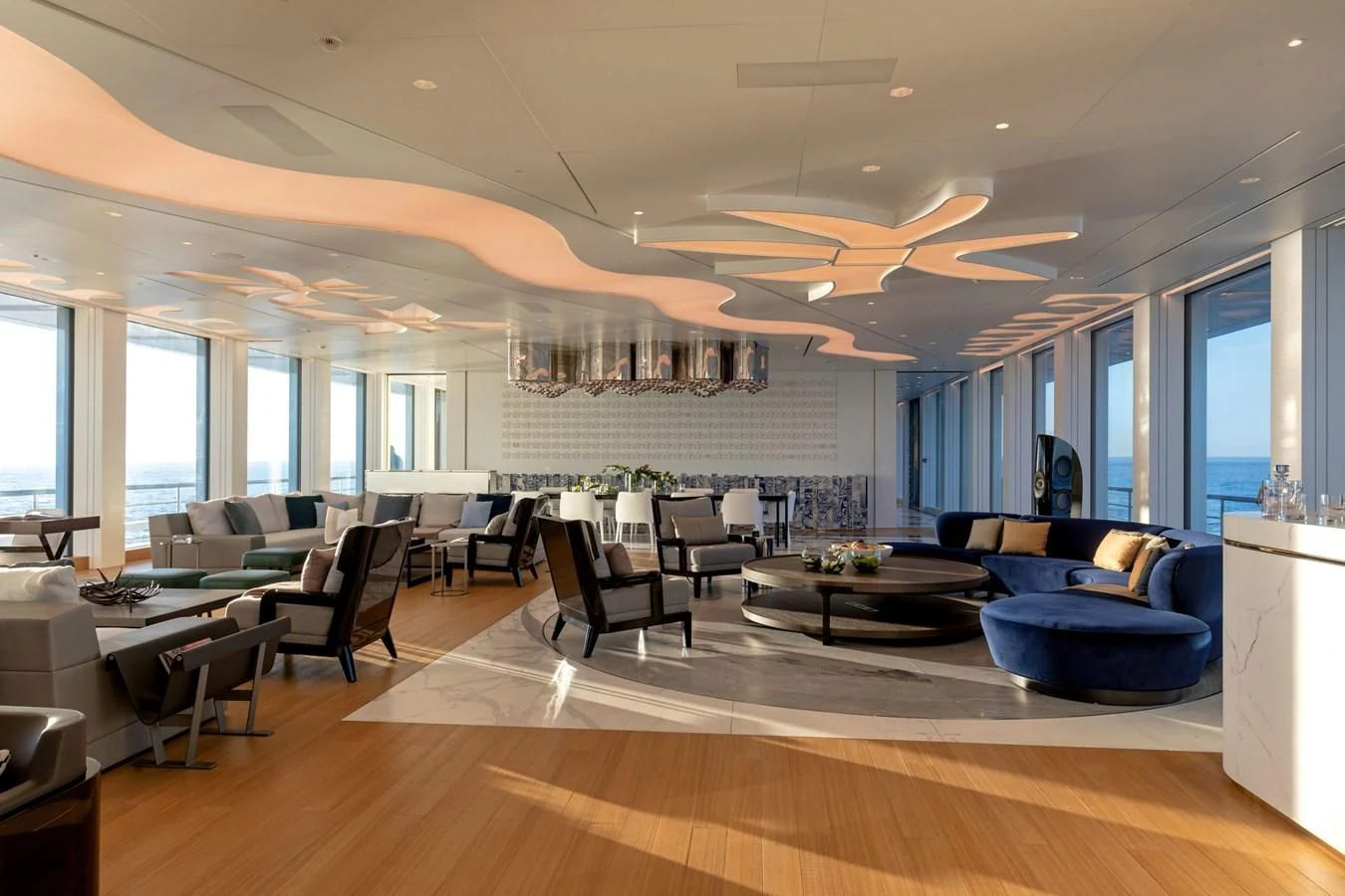 a living room with a large window aboard LUMINOSITY Yacht for Sale