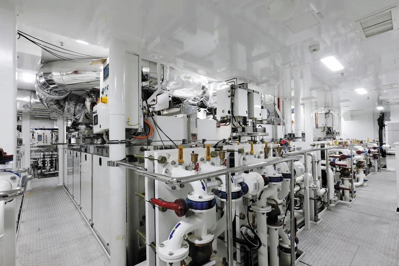 a room with several white pipes aboard LUMINOSITY Yacht for Sale