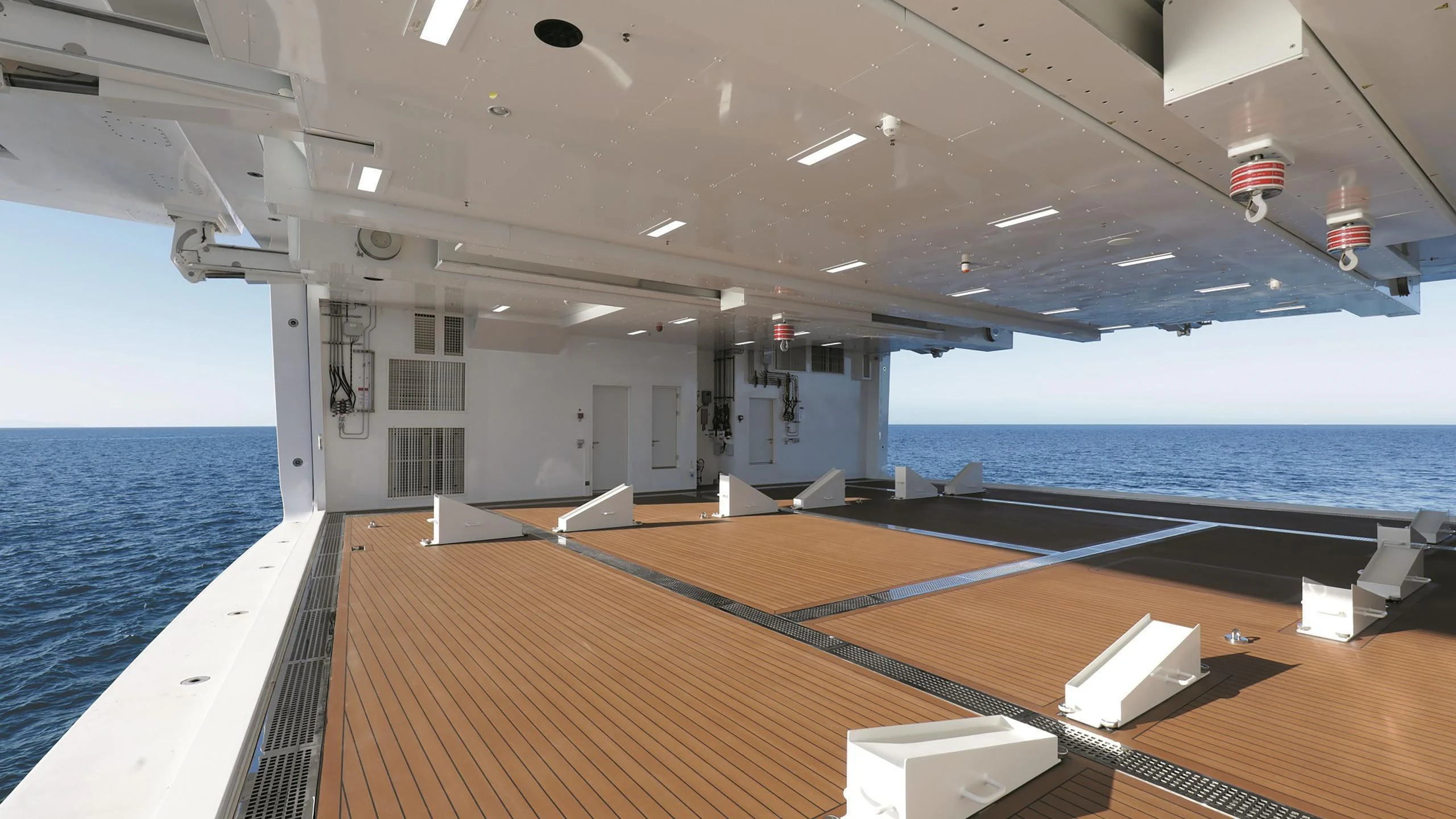 a pool with a deck and a deck and a deck aboard LUMINOSITY Yacht for Sale