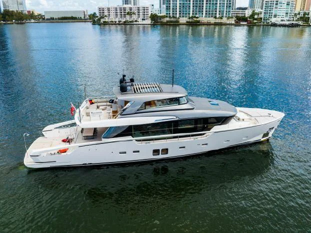 a white boat on the water aboard ABOUT TIME Yacht for Sale