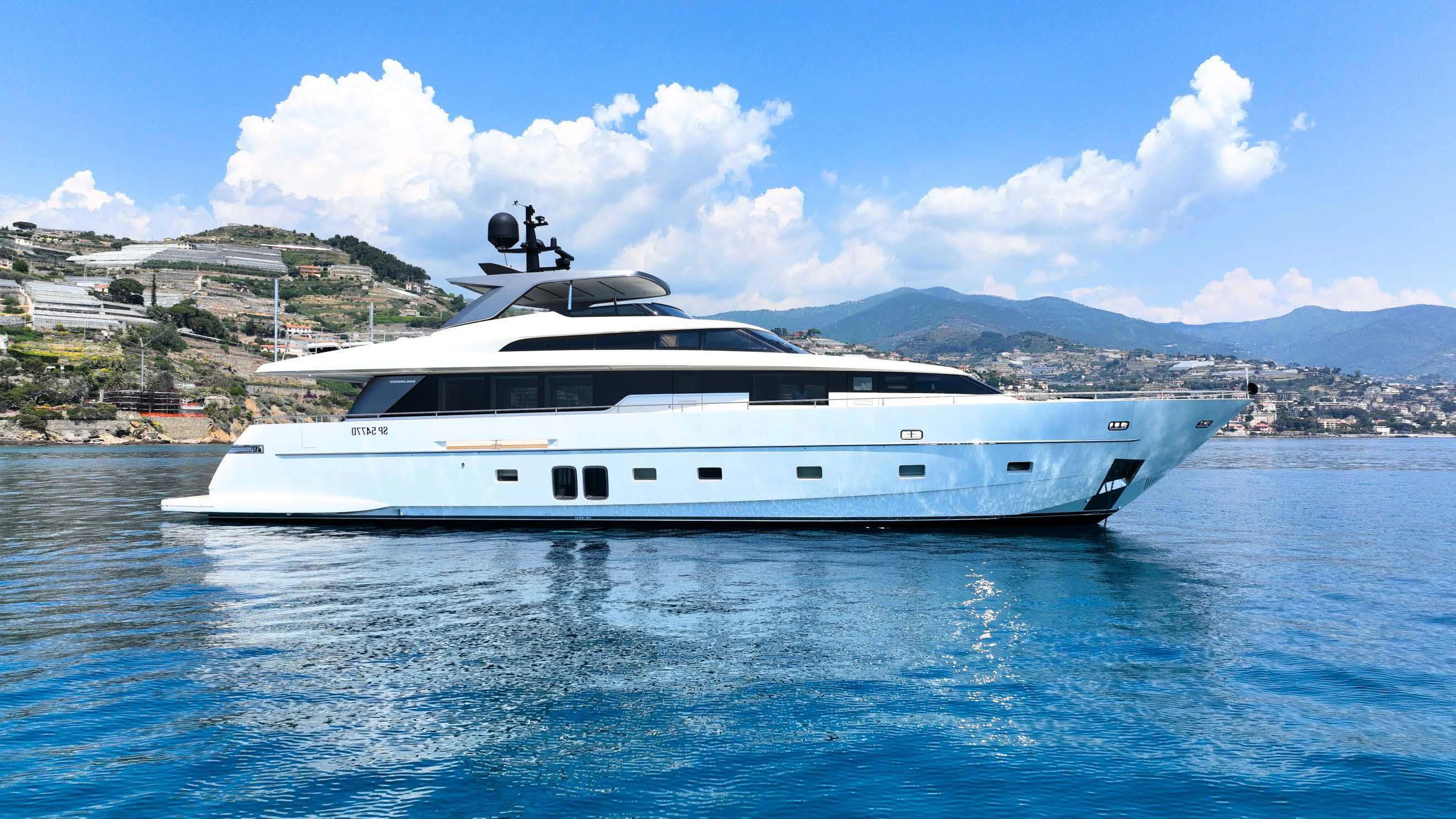 a white yacht in the water aboard AMAN Yacht for Sale