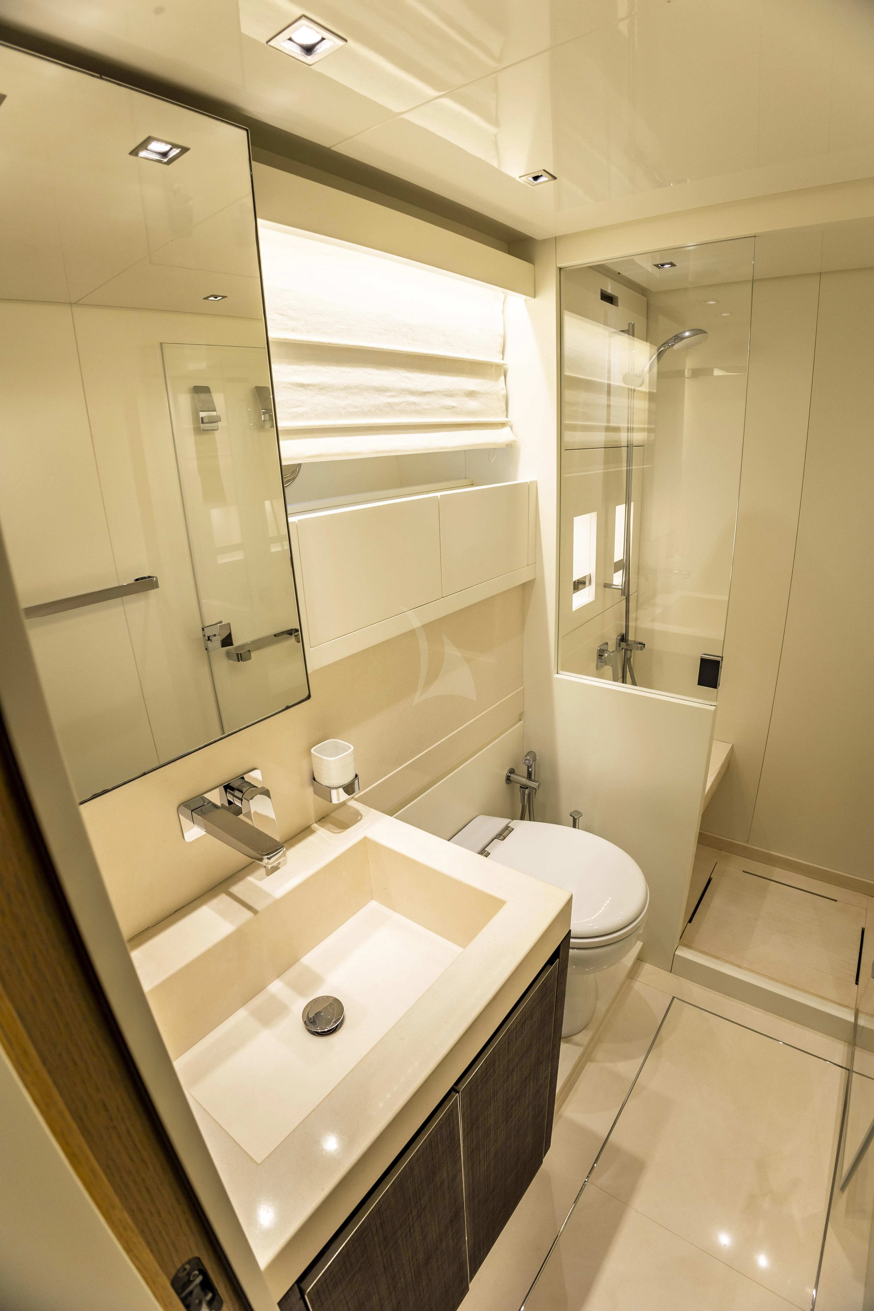 a bathroom with a sink and a toilet aboard AMAN Yacht for Sale