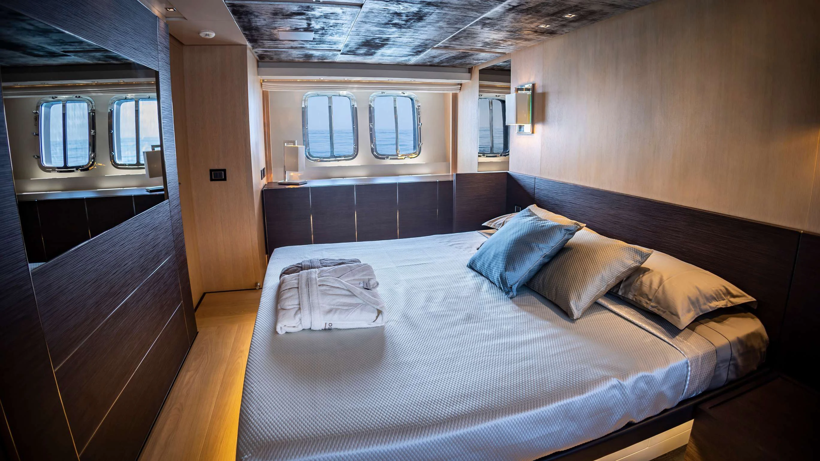 a bed in a cabin aboard AMAN Yacht for Sale