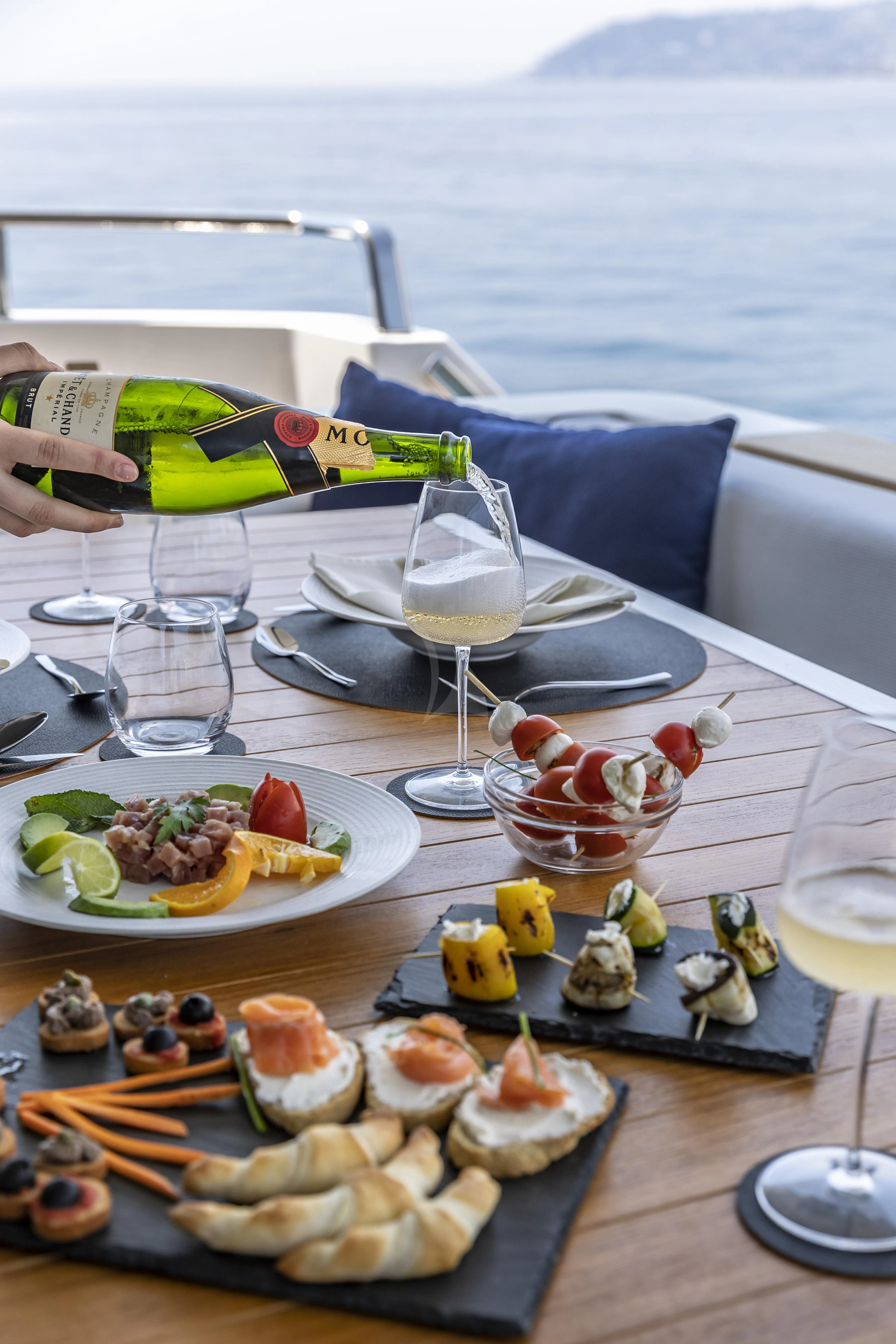 a table with food on it aboard AMAN Yacht for Sale