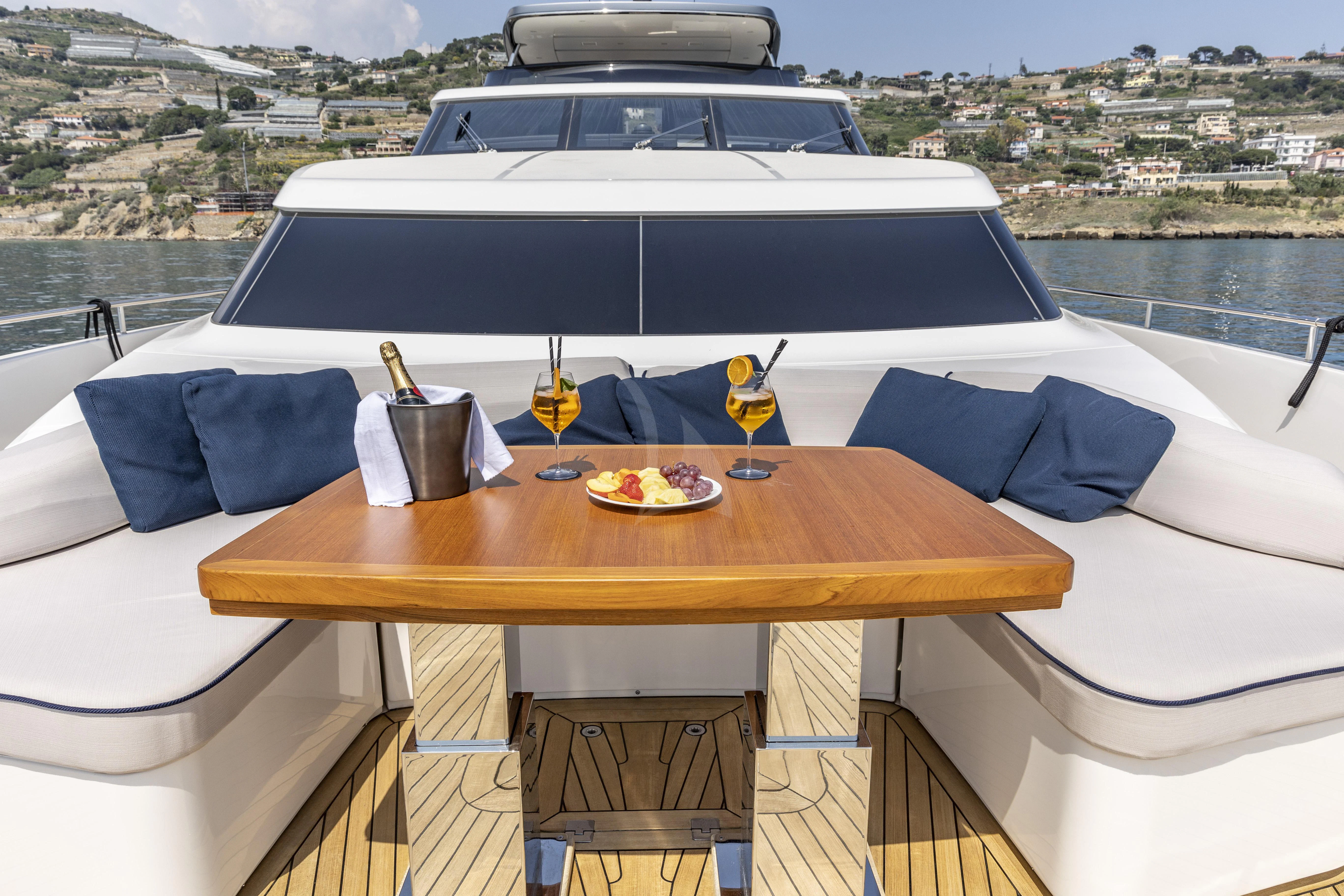 a table with food on it aboard AMAN Yacht for Sale