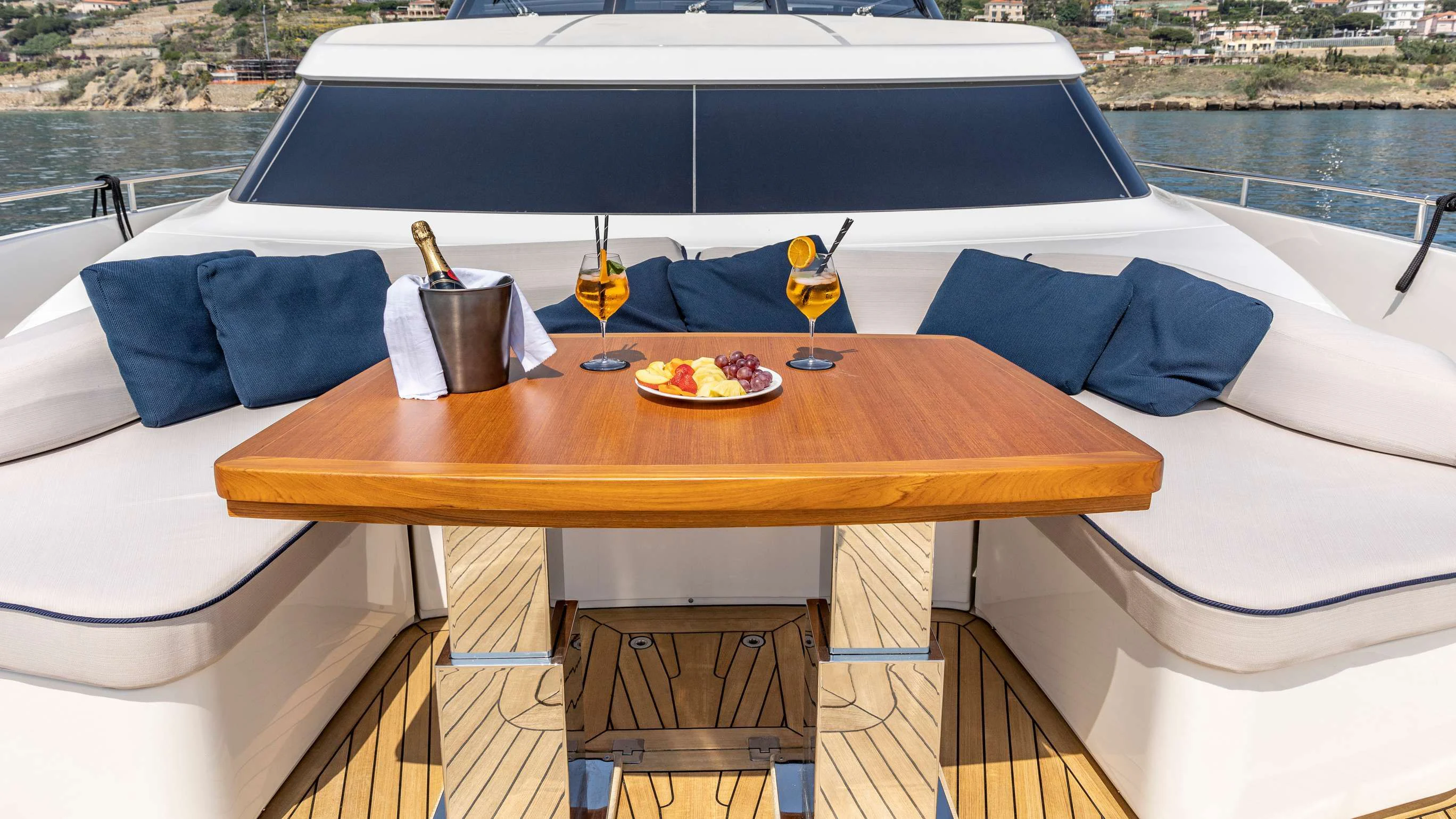 a table with a tray of food on it aboard AMAN Yacht for Sale