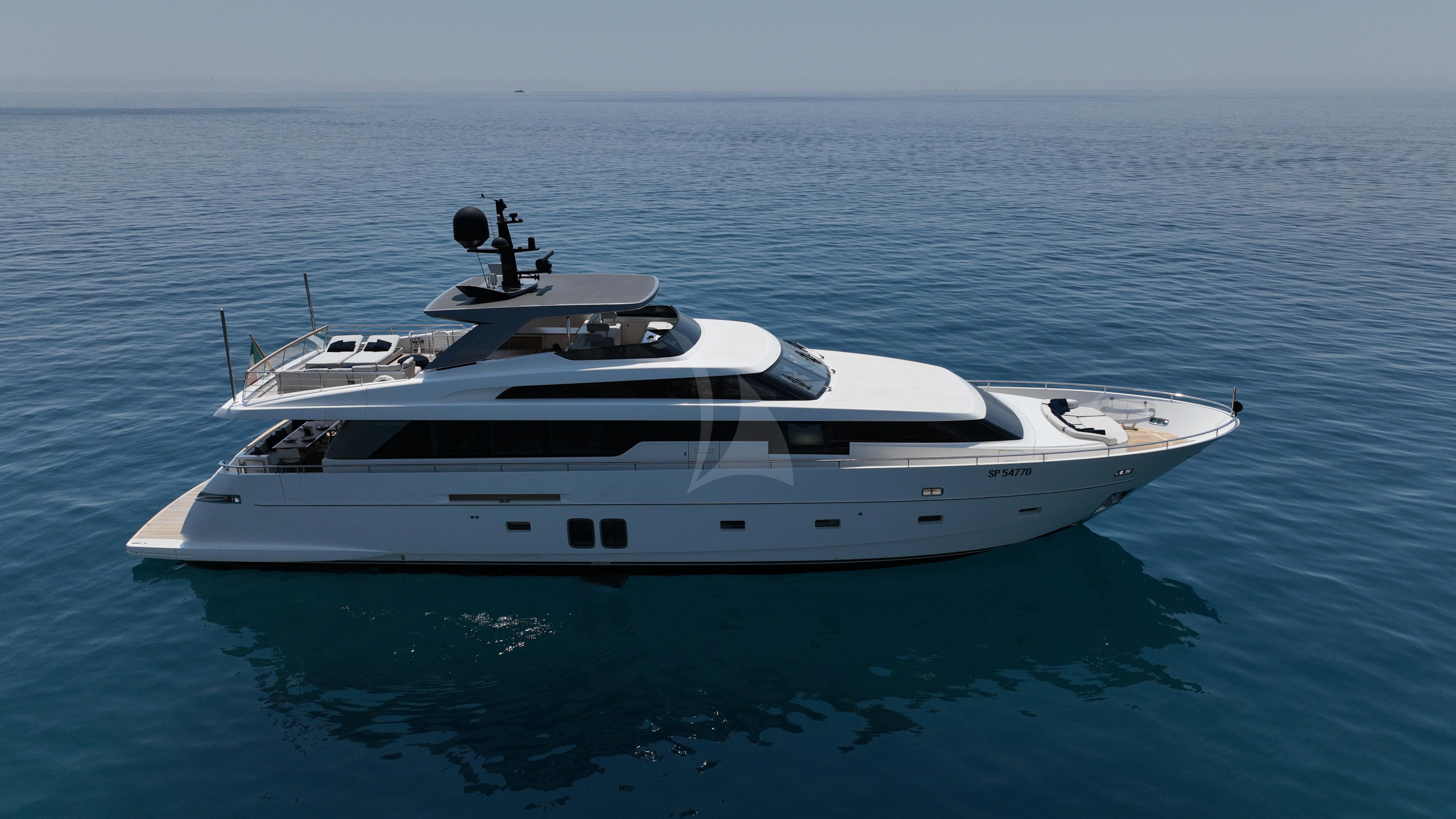a white yacht in the water aboard AMAN Yacht for Sale