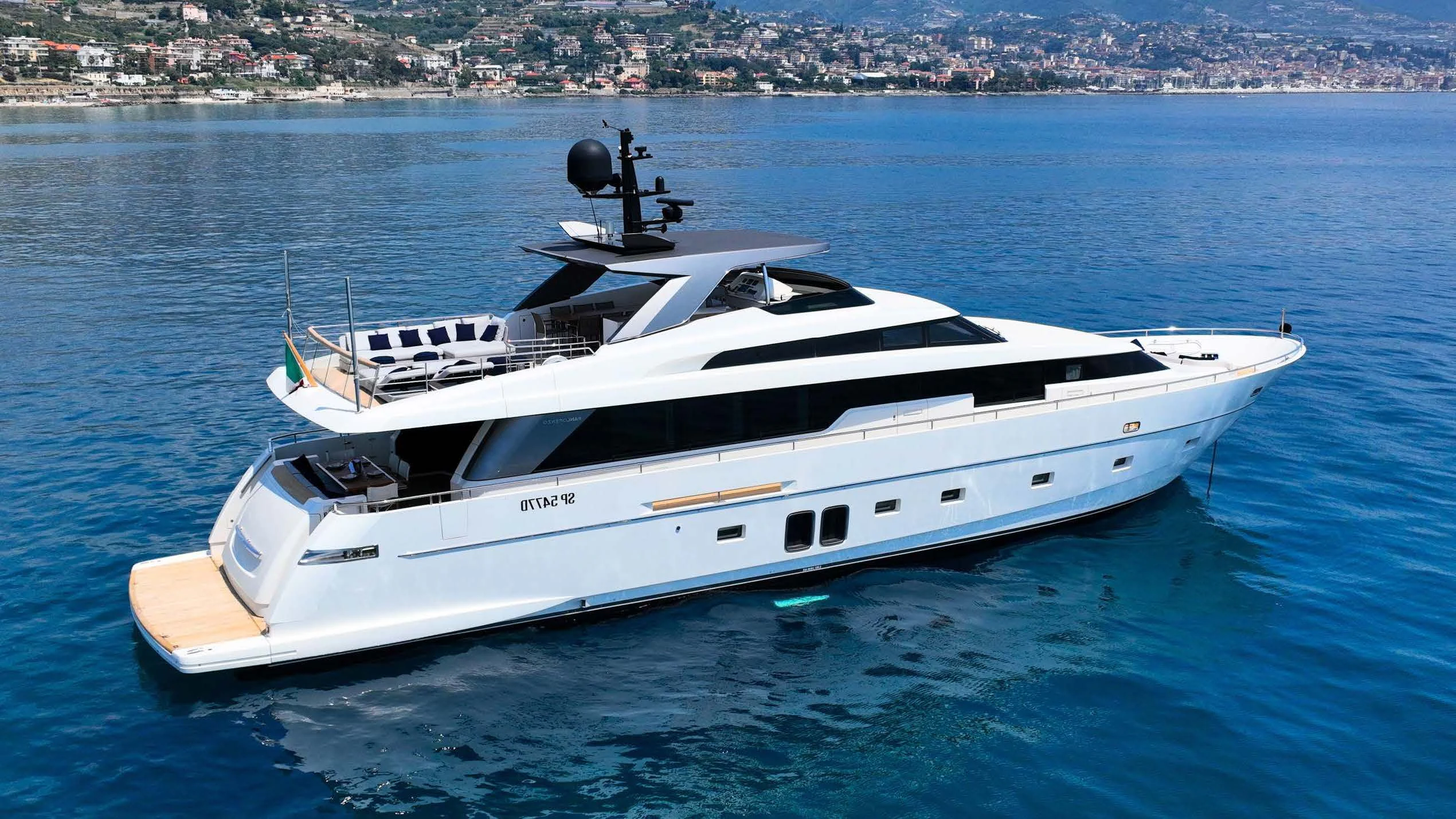 a white yacht on the water aboard AMAN Yacht for Sale