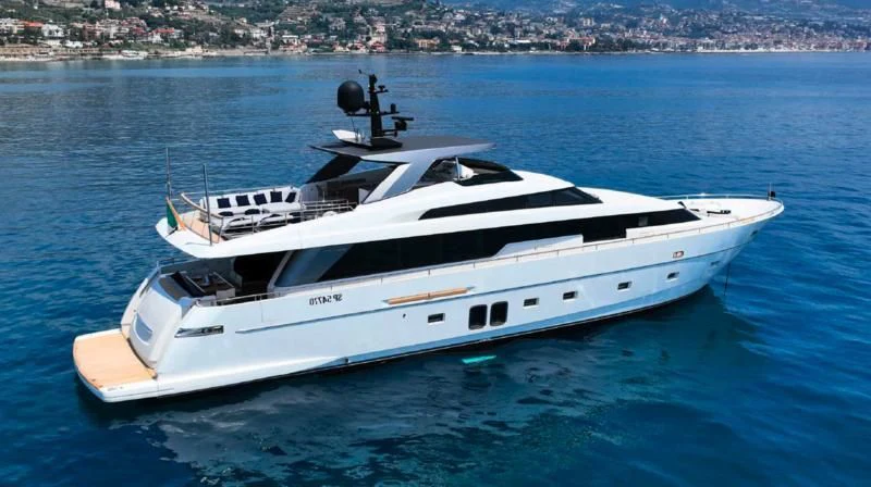 a white yacht on the water aboard AMAN Yacht for Sale