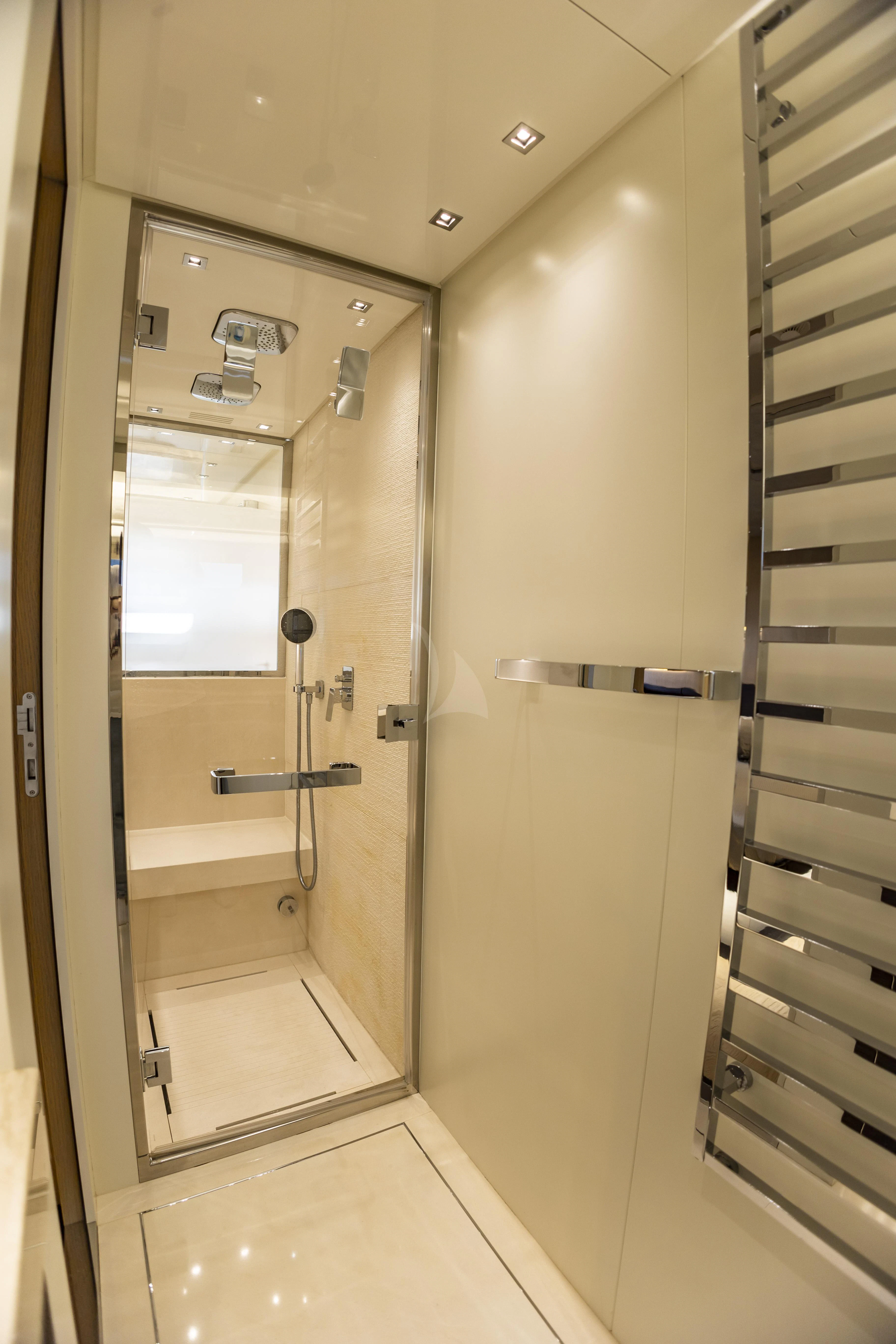 a shower unit in a bathroom aboard AMAN Yacht for Sale