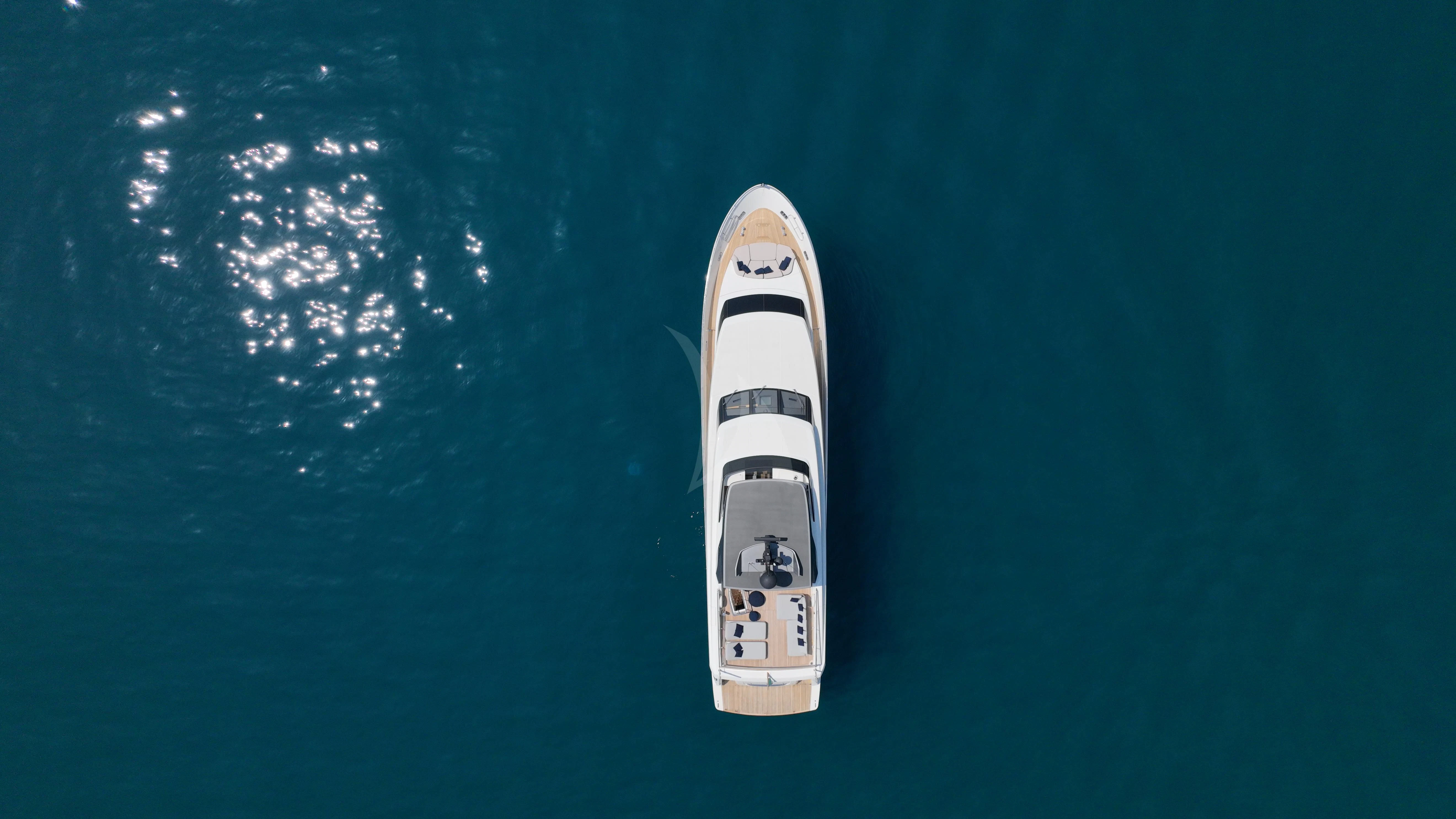 a white and black boat in the water aboard AMAN Yacht for Sale
