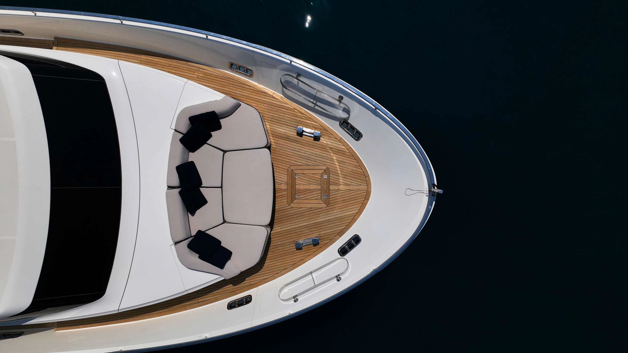 a white and black car aboard AMAN Yacht for Sale