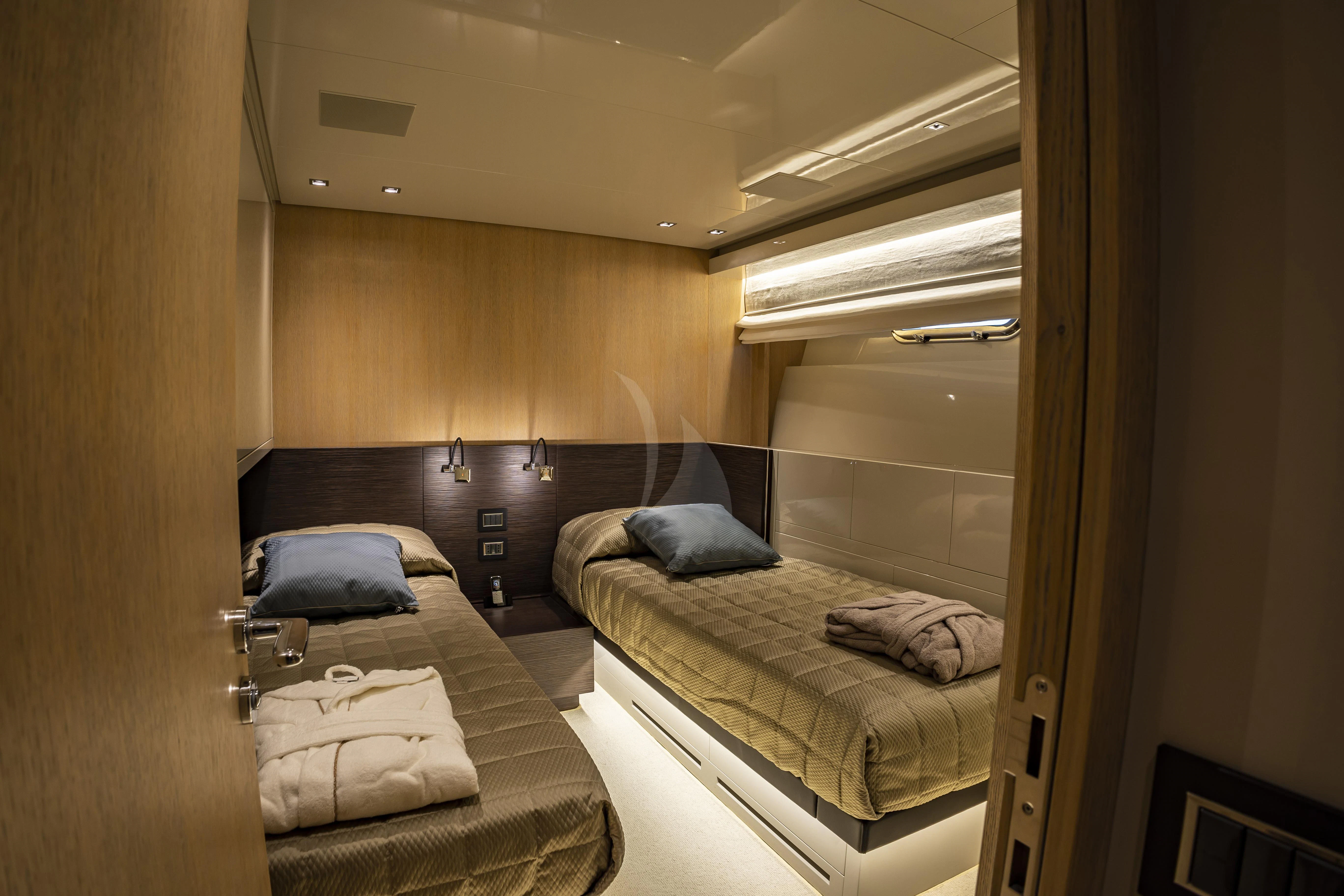 a couple of beds in a hotel room aboard AMAN Yacht for Sale