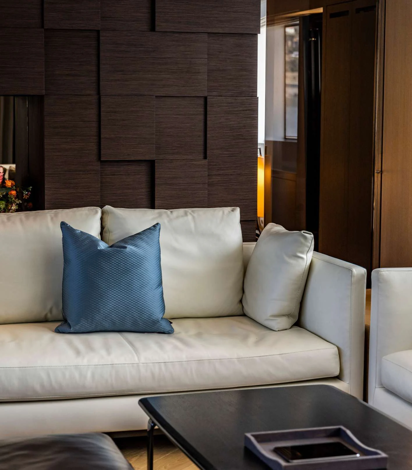 a couch with pillows on it aboard AMAN Yacht for Sale