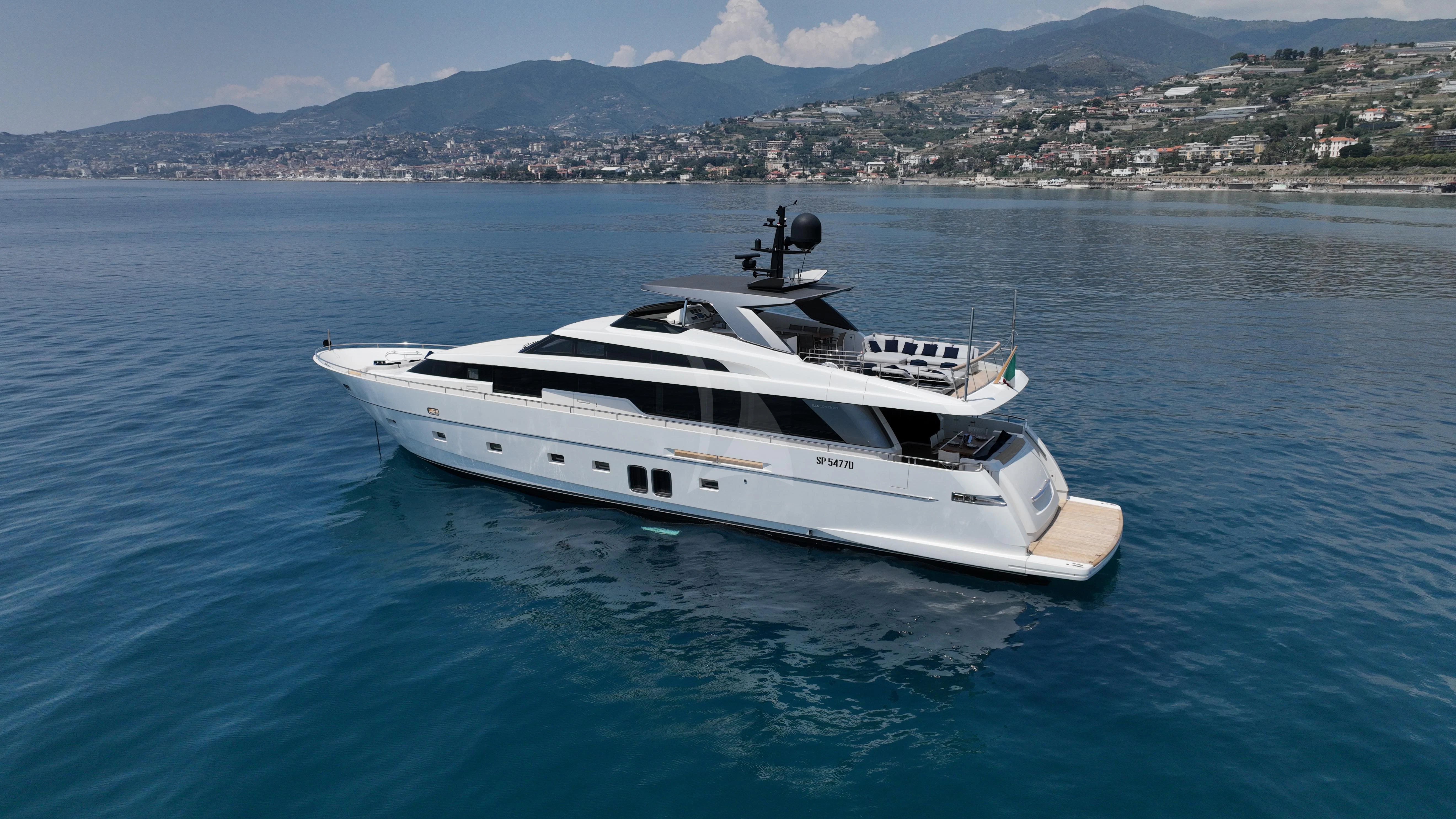 a white yacht in the water aboard AMAN Yacht for Sale