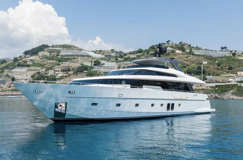 a white yacht in the water aboard AMAN Yacht for Sale
