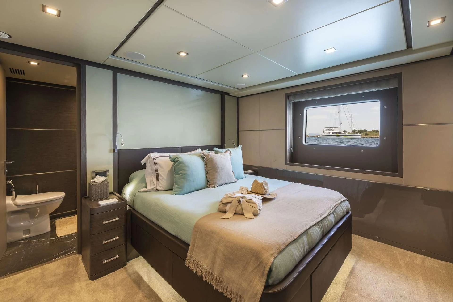a bedroom with a bed and a television aboard ORSO 3 Yacht for Sale
