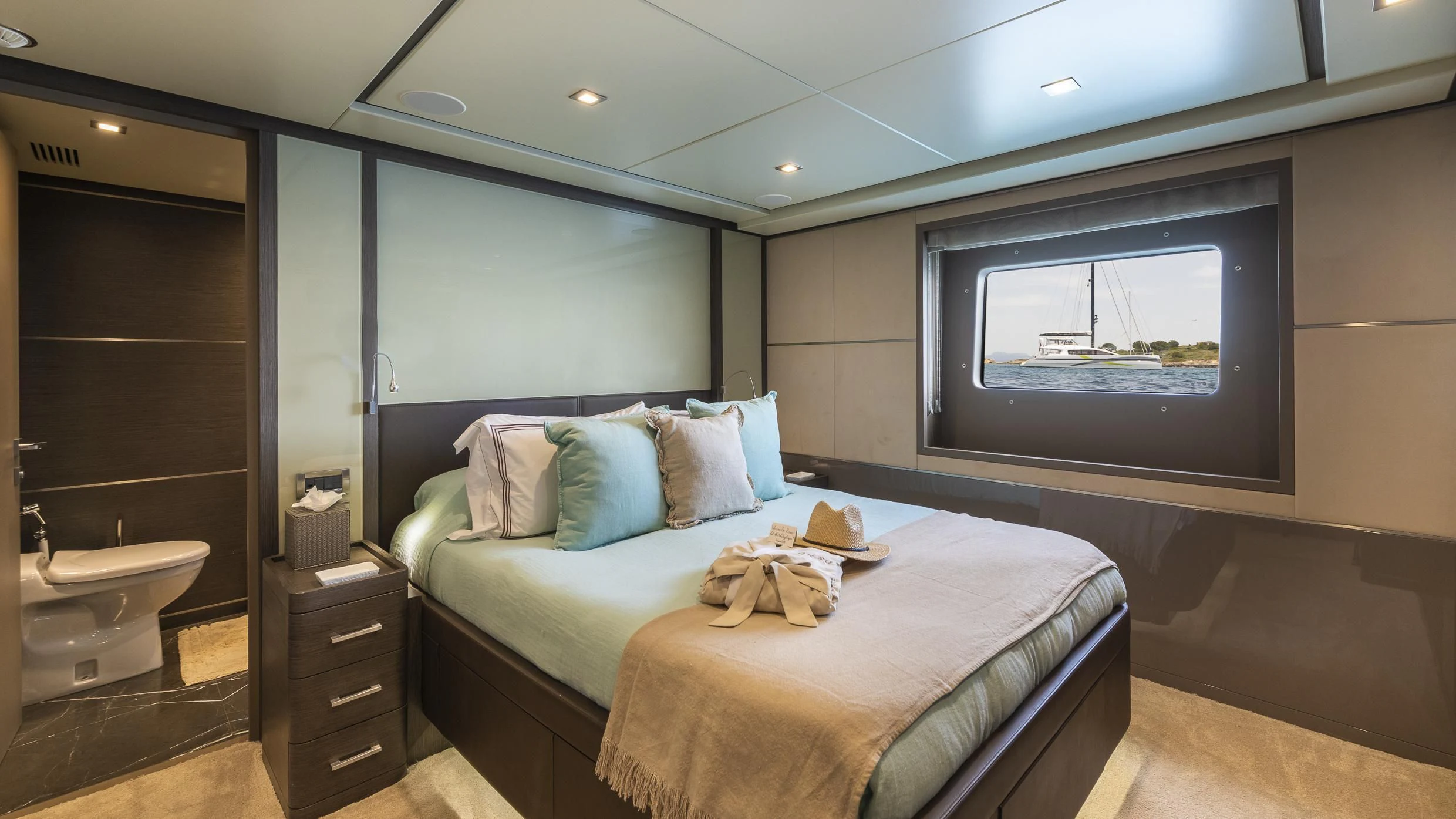 a bedroom with a bed and a sink aboard ORSO 3 Yacht for Sale