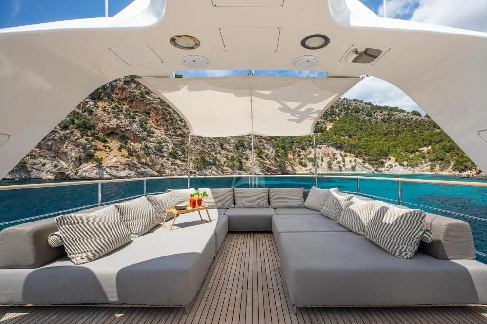 a room with a couch and a pool aboard ORSO 3 Yacht for Sale