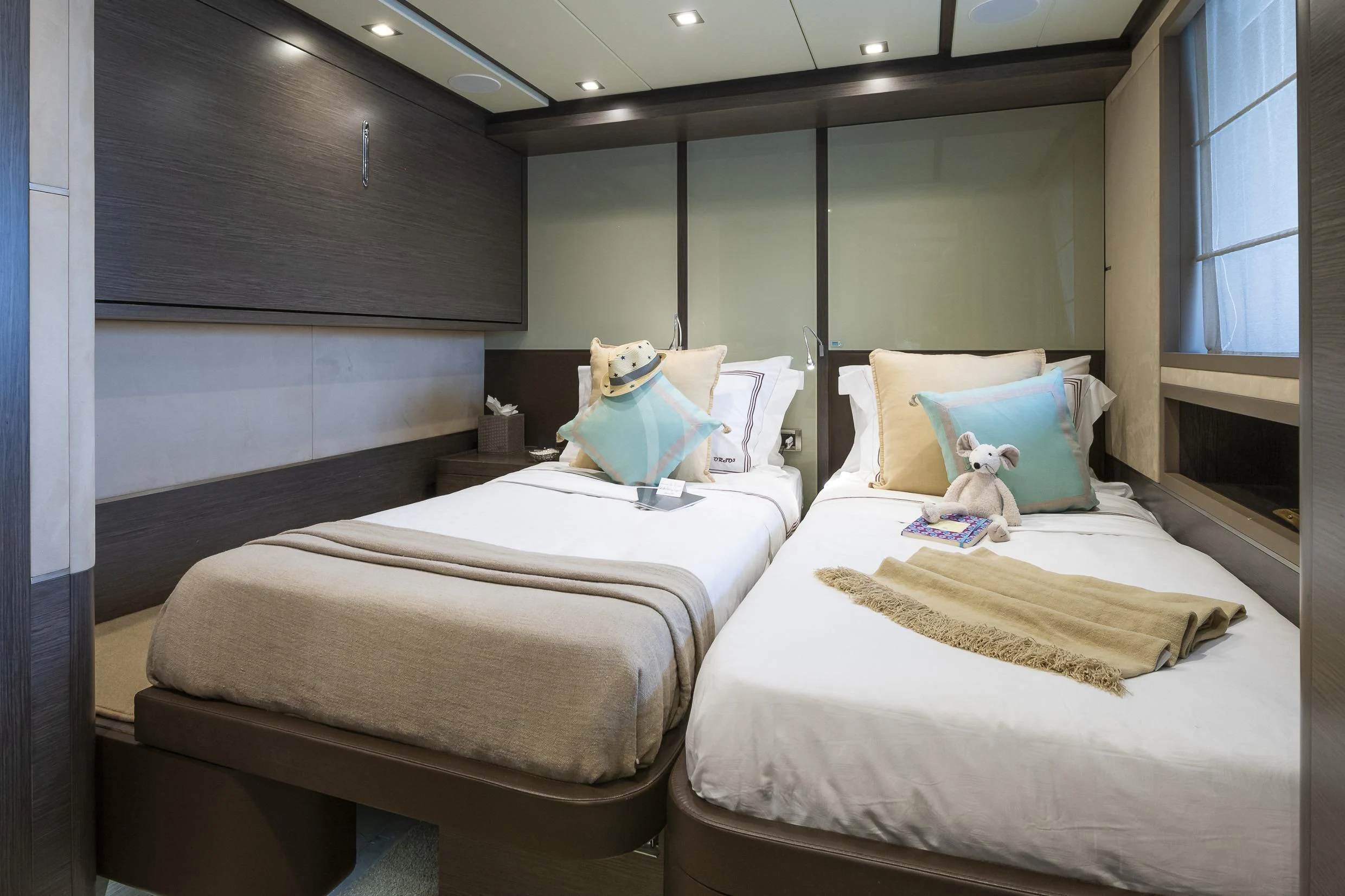 a couple of beds in a room aboard ORSO 3 Yacht for Sale