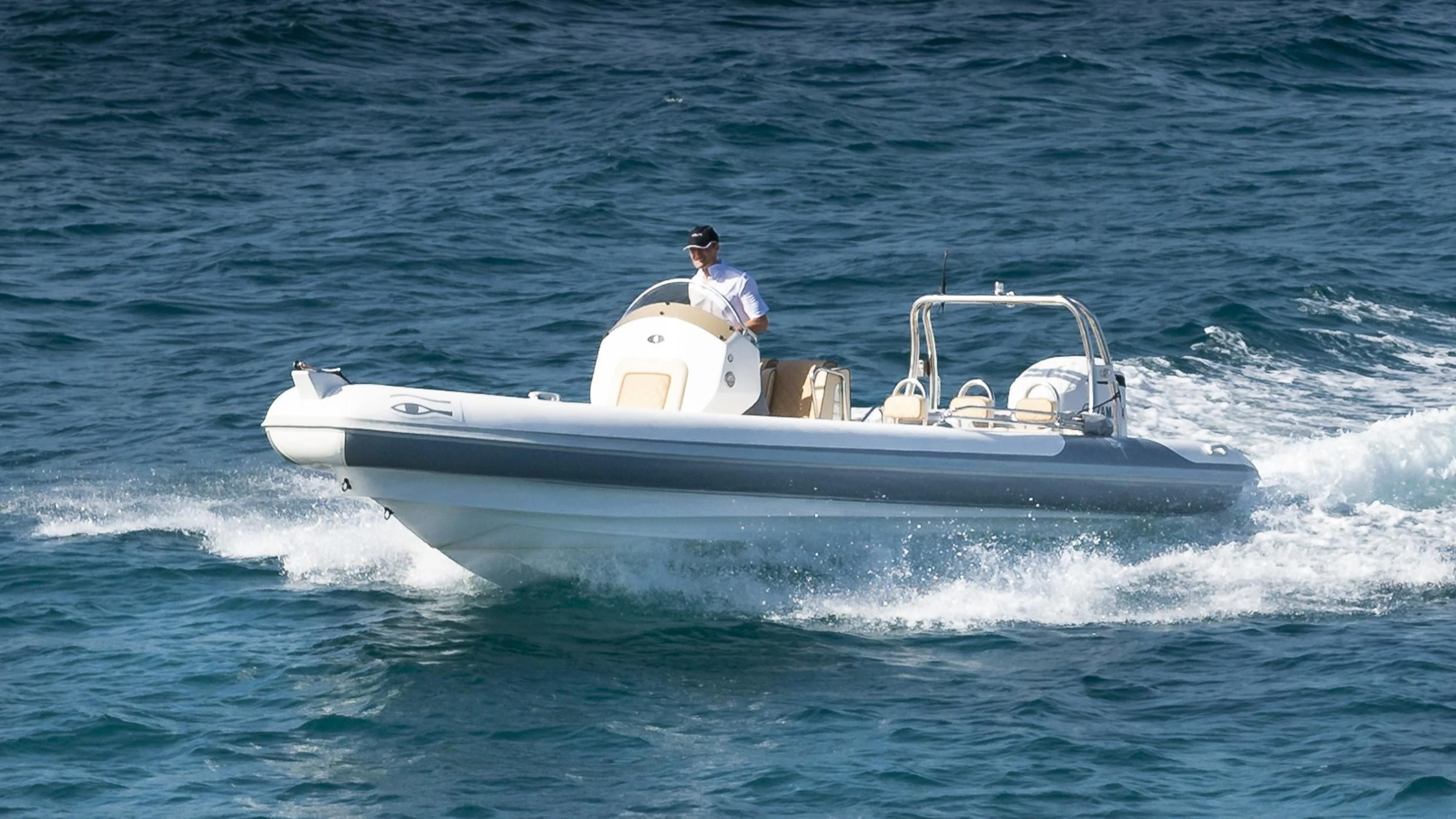 a man driving a boat aboard ORSO 3 Yacht for Sale