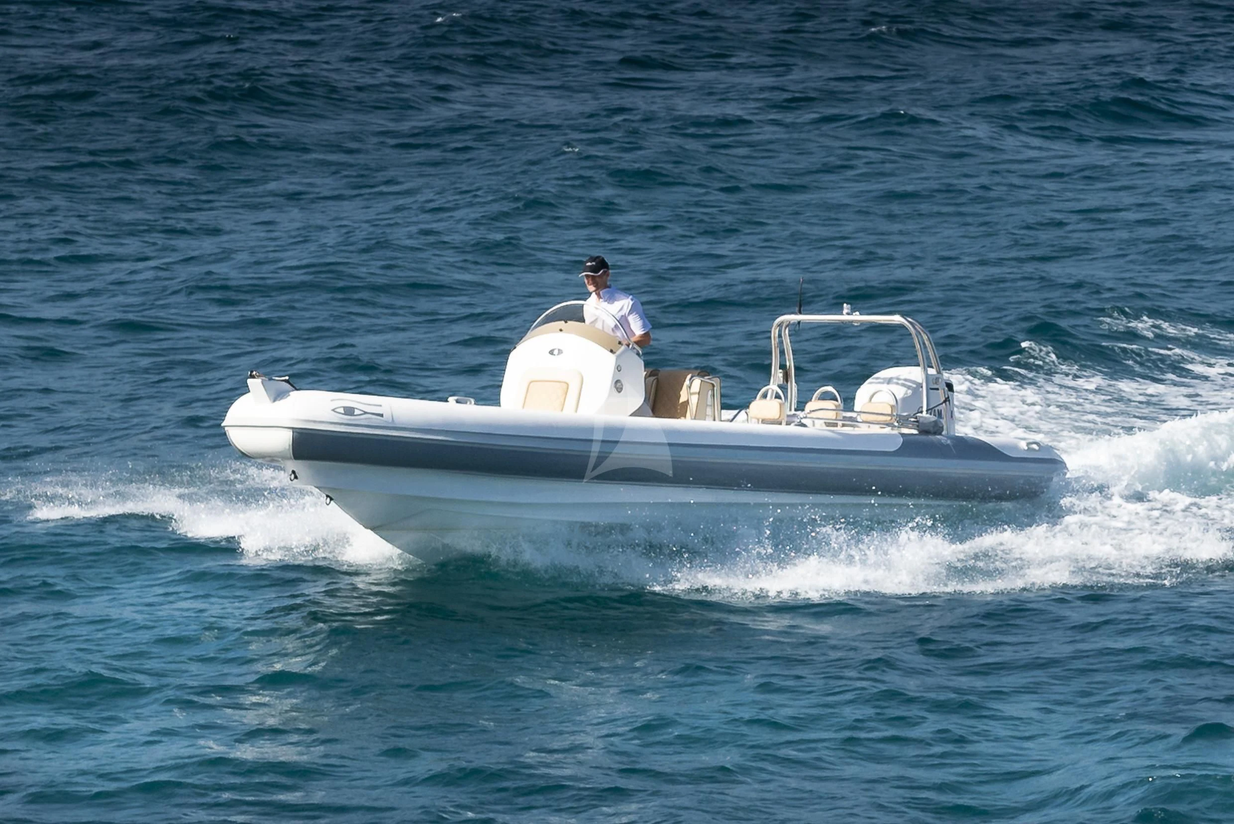 a man driving a boat aboard ORSO 3 Yacht for Sale