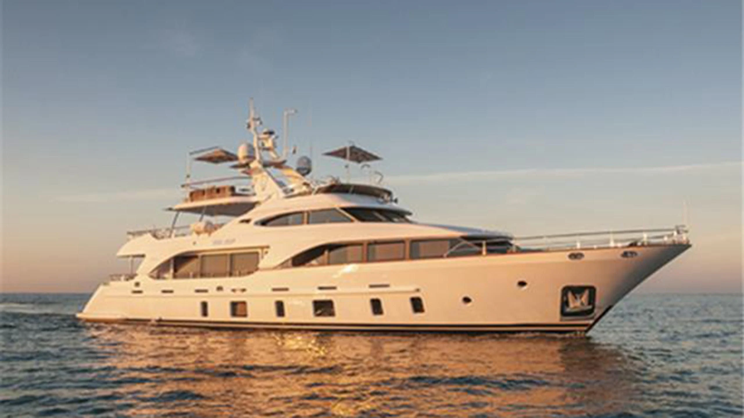 a white yacht on the water aboard ORSO 3 Yacht for Sale