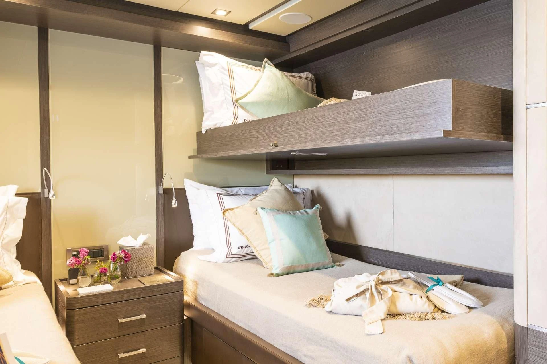a bed with a white comforter and pillows aboard ORSO 3 Yacht for Sale