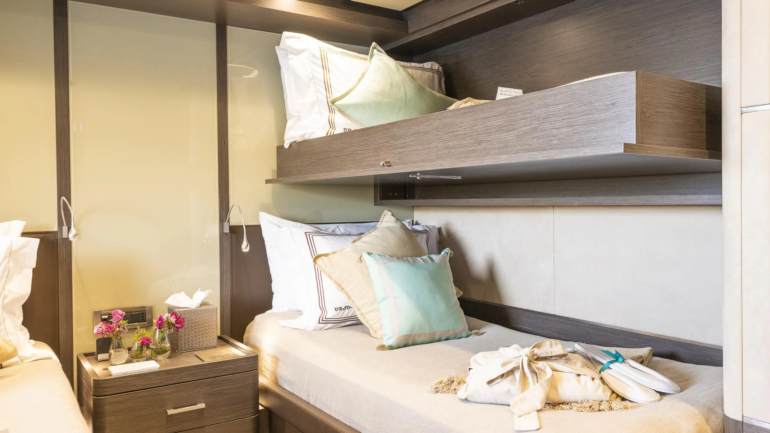a bed with white sheets and pillows aboard ORSO 3 Yacht for Sale