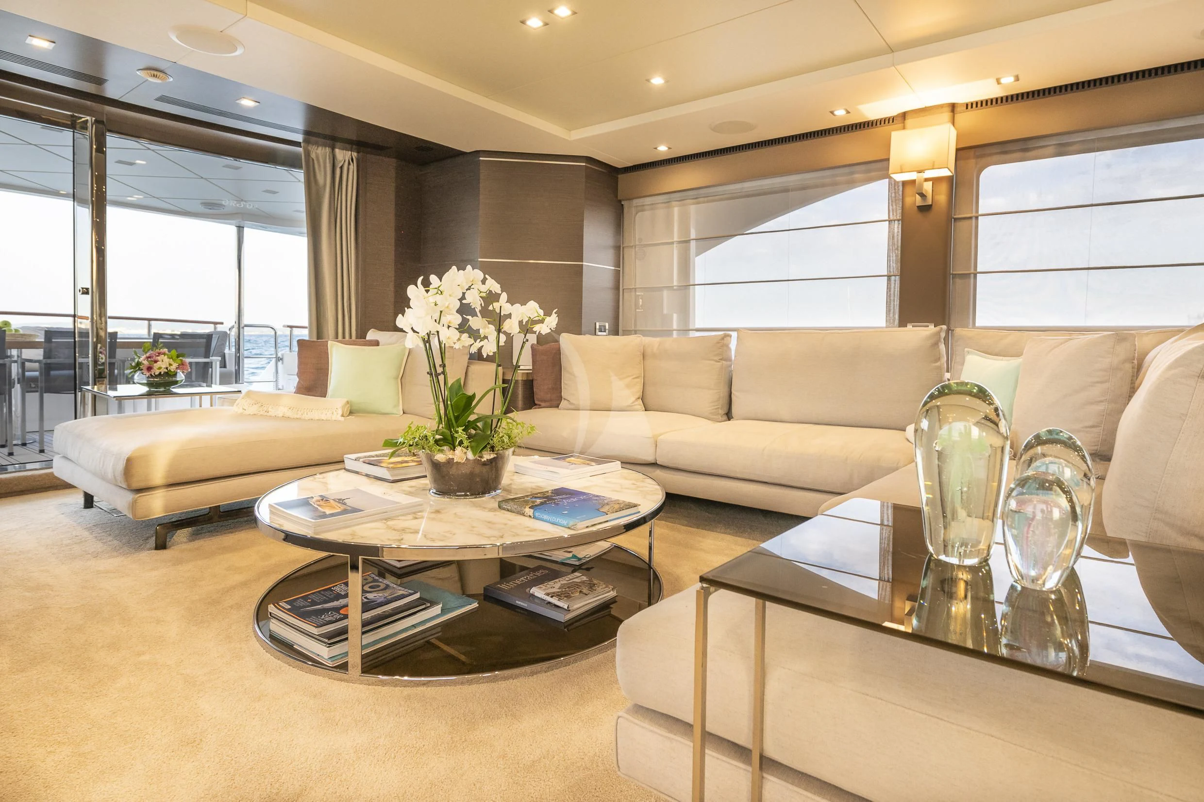 a living room with a couch and coffee table aboard ORSO 3 Yacht for Sale