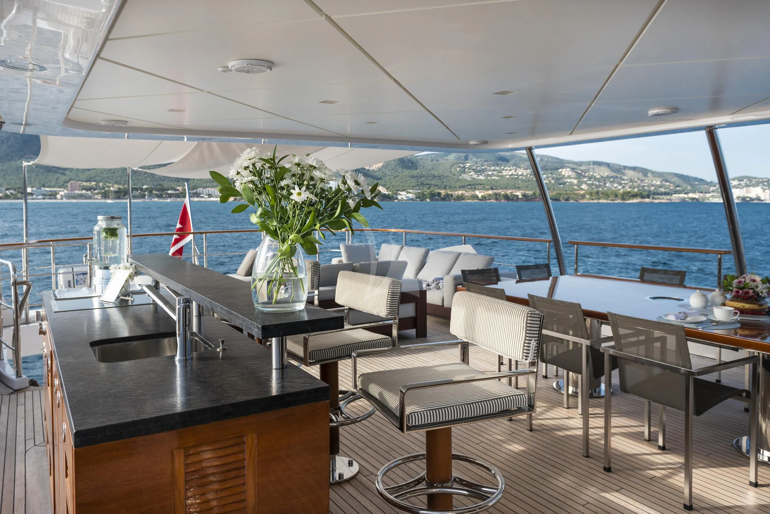 a room with a table and chairs aboard ORSO 3 Yacht for Sale