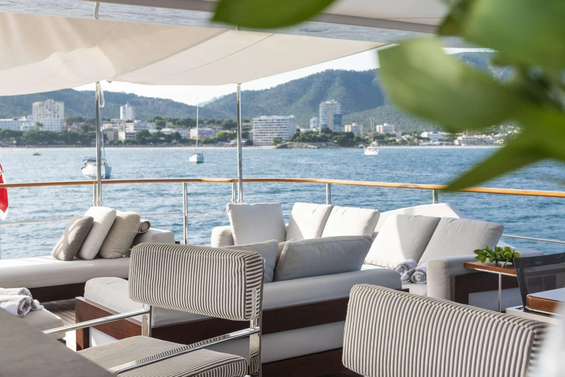 a room with chairs and a view of a city aboard ORSO 3 Yacht for Sale