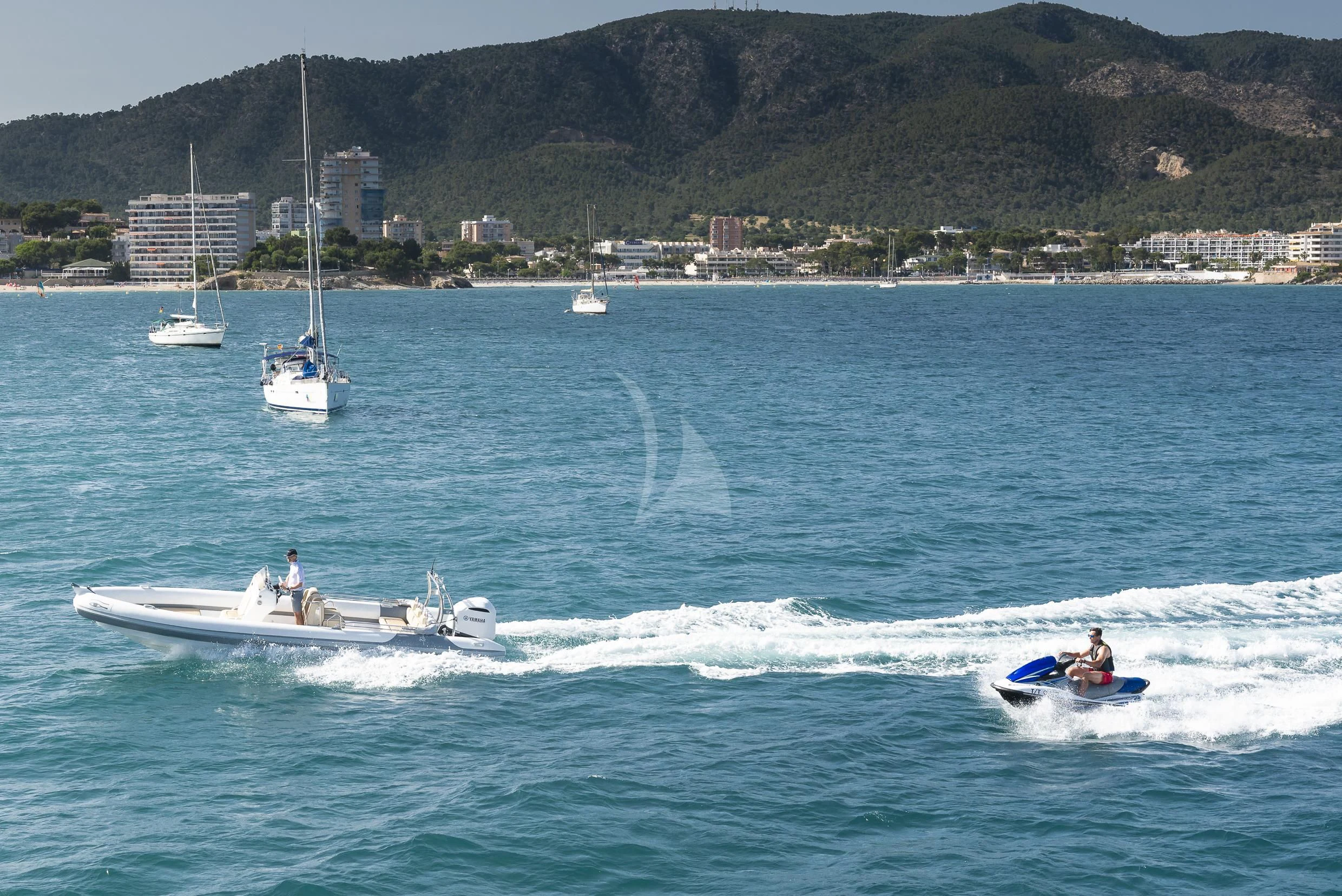 a couple of people on a jet ski in the water aboard ORSO 3 Yacht for Sale