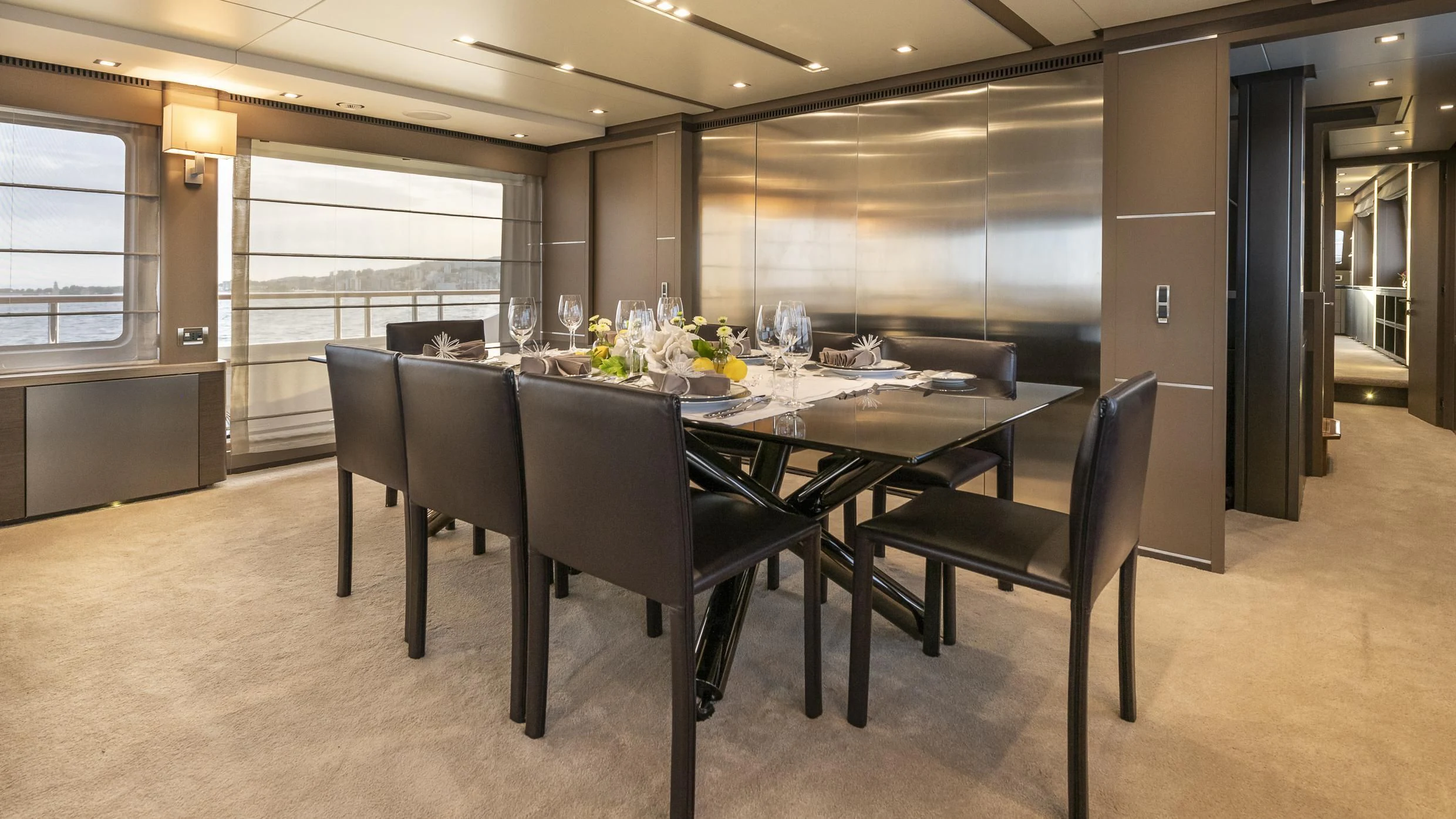 a large room with a table and chairs aboard ORSO 3 Yacht for Sale