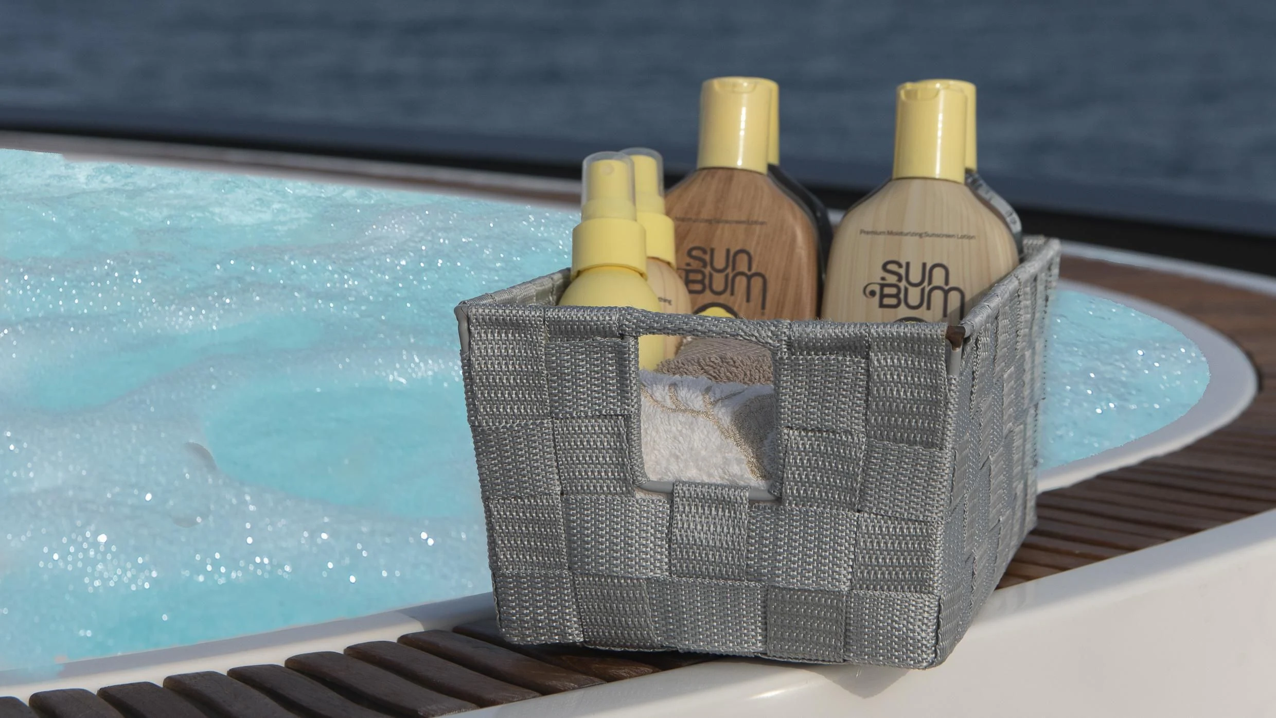 a brown and black container with yellow liquid in it next to a swimming pool aboard ORSO 3 Yacht for Sale