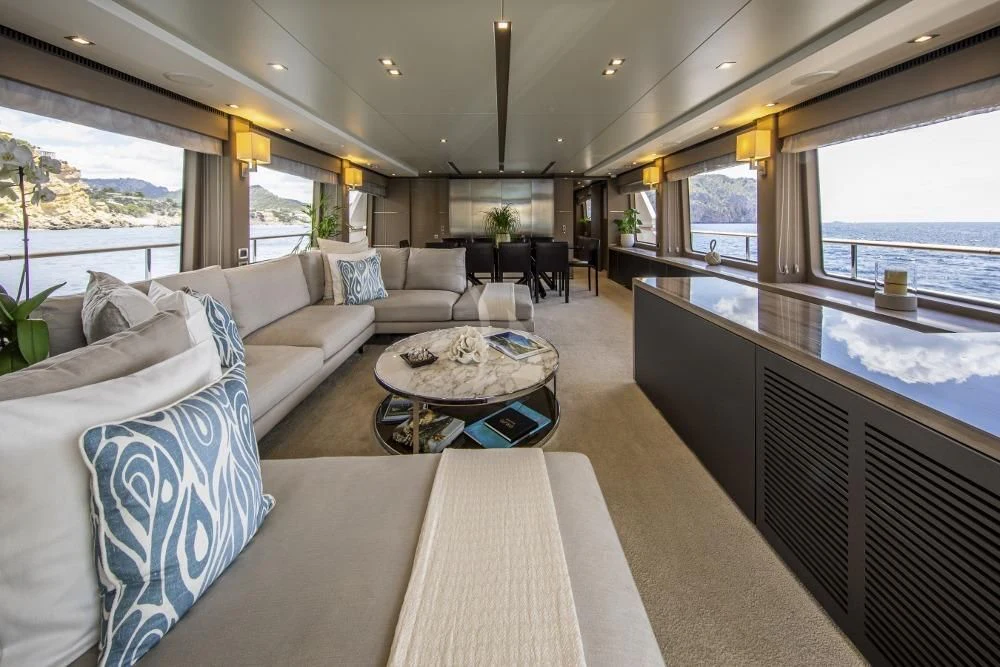 a living room with a large window aboard ORSO 3 Yacht for Sale