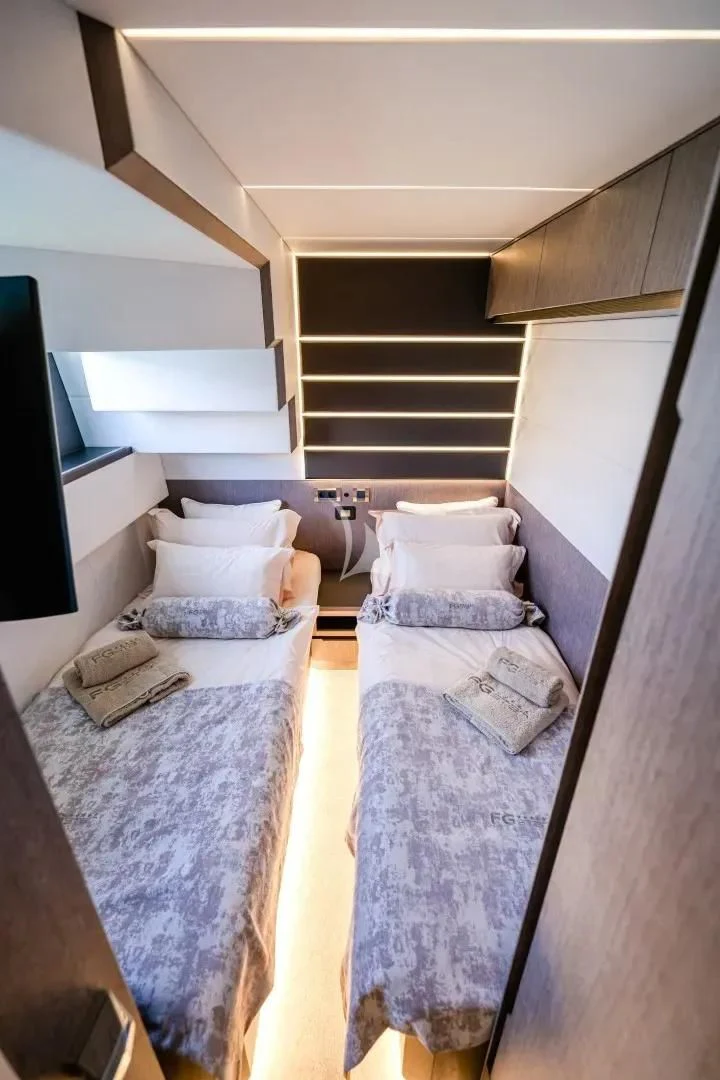 a bedroom with a couple of beds aboard FG STAR Yacht for Charter