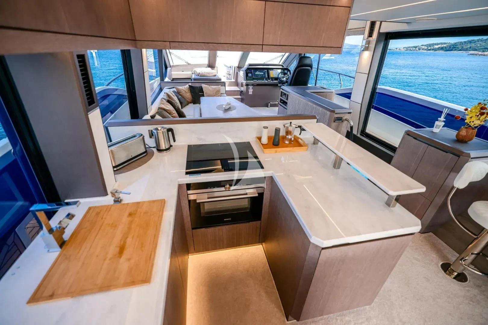 a room with a large window and a desk with a computer on it aboard FG STAR Yacht for Charter