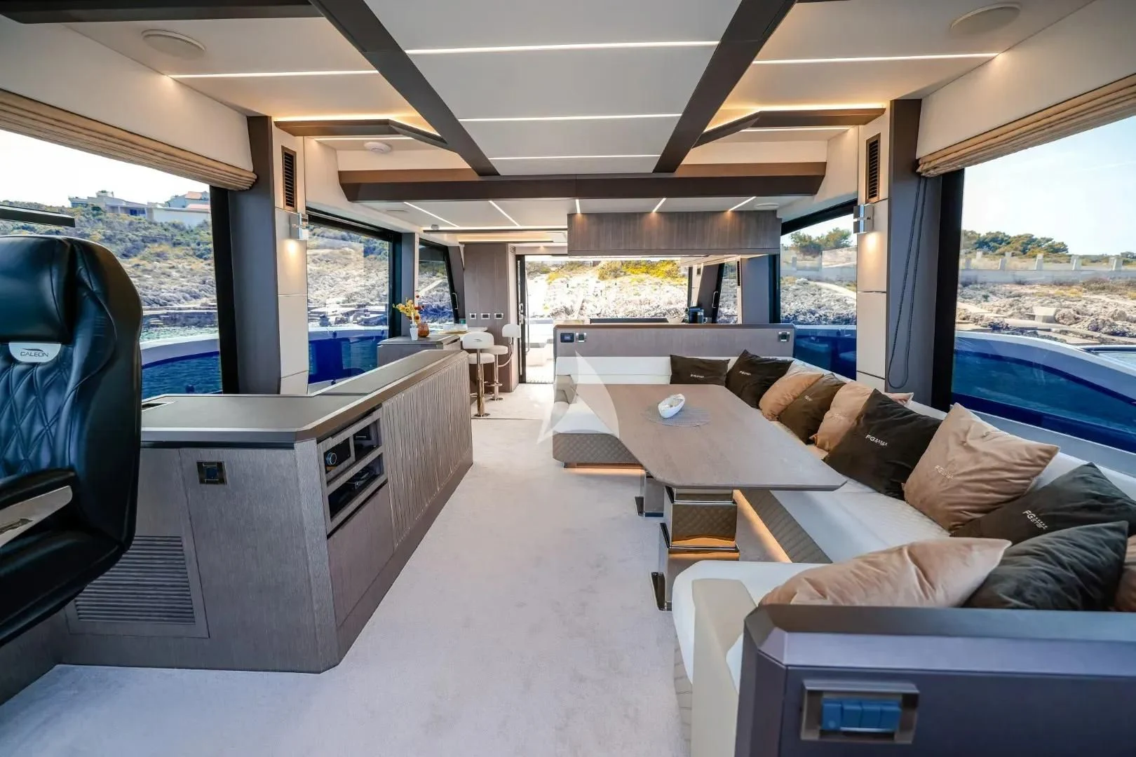 a living room with a large window aboard FG STAR Yacht for Charter