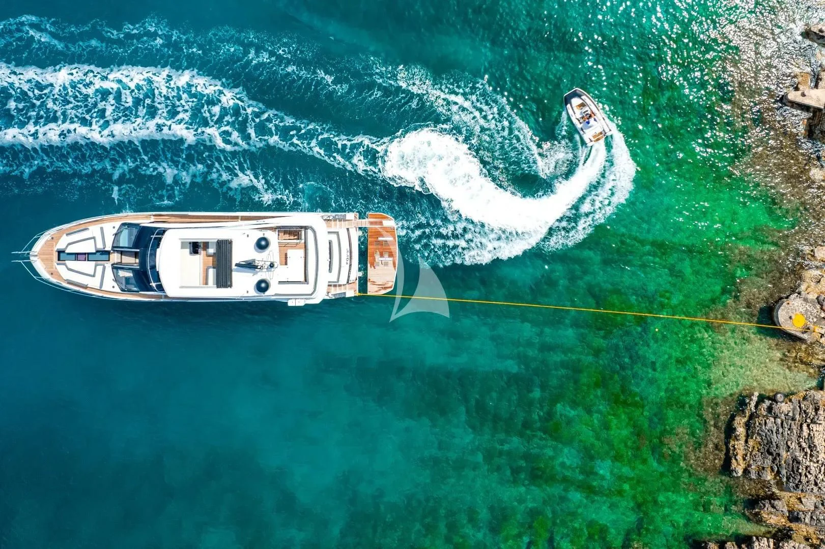 a helicopter flying over a body of water aboard FG STAR Yacht for Charter