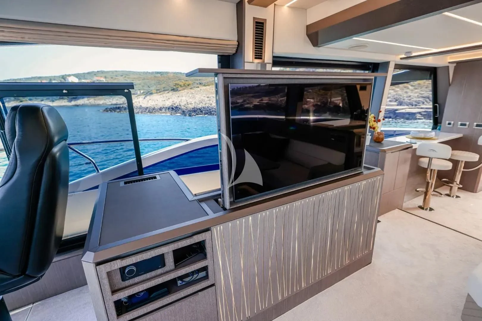 a large flat screen television on a boat aboard FG STAR Yacht for Charter