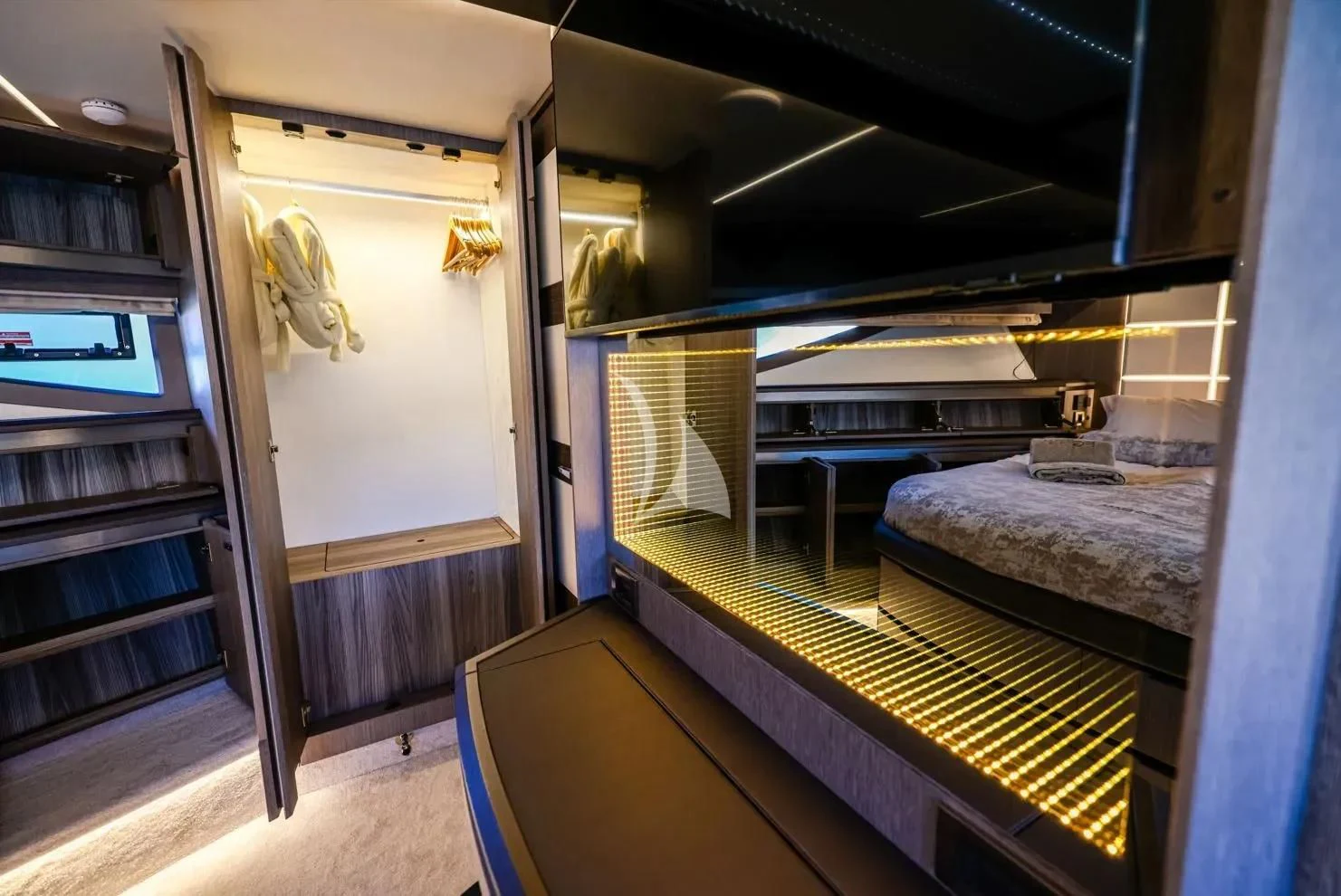 a room with a bed and a bookcase aboard FG STAR Yacht for Charter