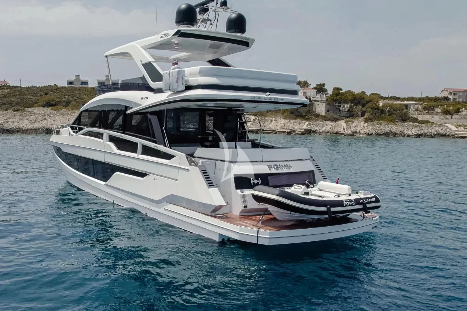 a white boat in the water aboard FG STAR Yacht for Charter