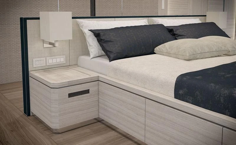 a bed with a white cover aboard ICE 68 Yacht for Sale