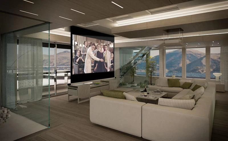 a living room with a large screen aboard ICE 68 Yacht for Sale