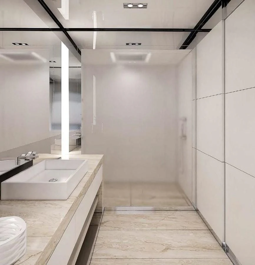 a bathroom with a sink and a large mirror aboard ICE 68 Yacht for Sale
