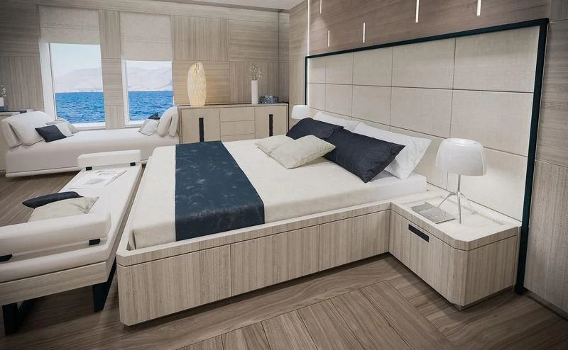 a room with a bed and a couch aboard ICE 68 Yacht for Sale